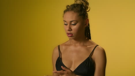 pensive woman thinking about problem solution and gesturing hands in studio