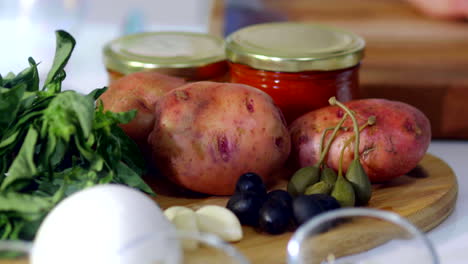 Sequence-shot,-peeling-potatoes-for-cooking