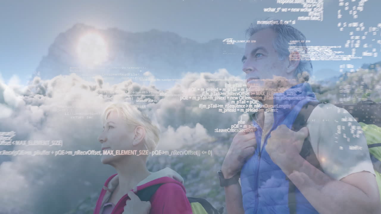 Mature couple hiking mountain trail above clouds, overlaying code visualizing technology data