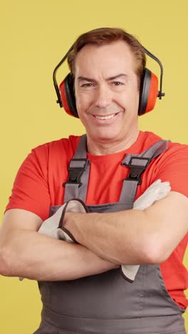 smiling worker in protective gear and overalls