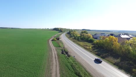 rural road with cars and autumn colors