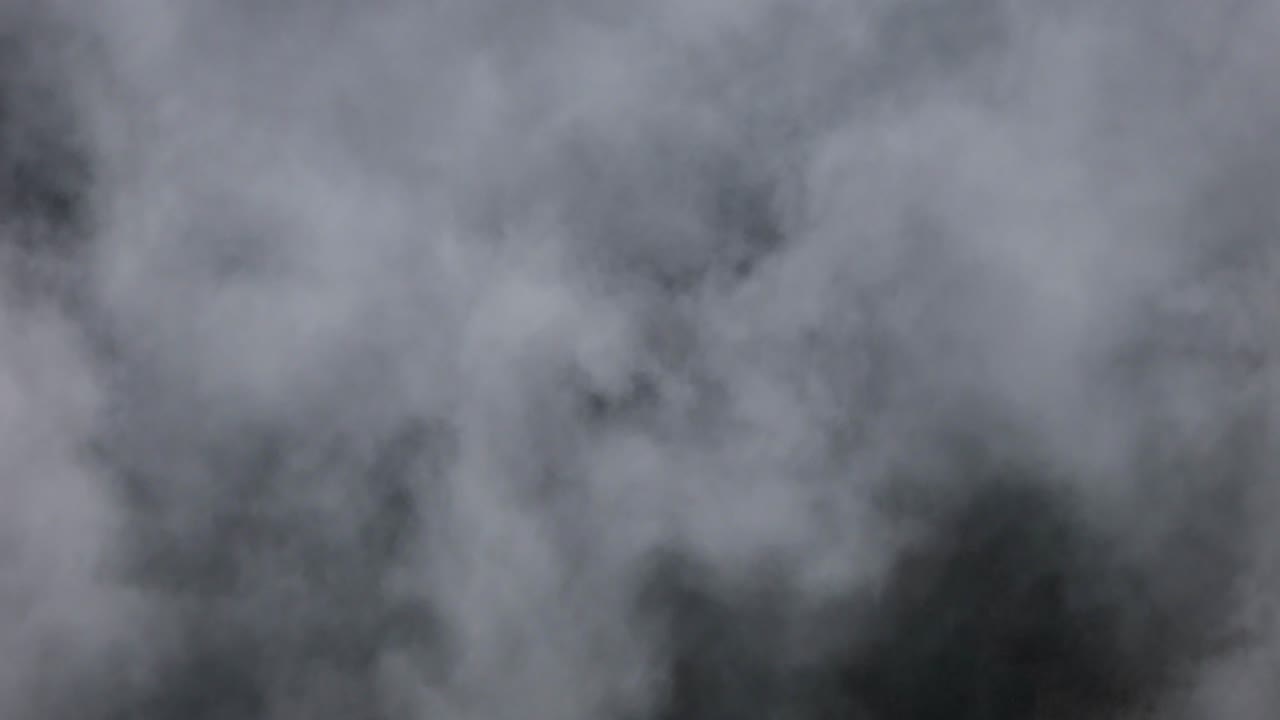 Drone shot flying above the cloud bank located in the mountainous pass of Paso de Cortés on the outskirts of Mexico City