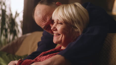 older couple sharing affection at home