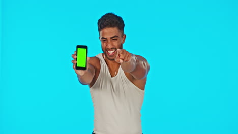 Face,-green-screen-and-man-with-phone-pointing