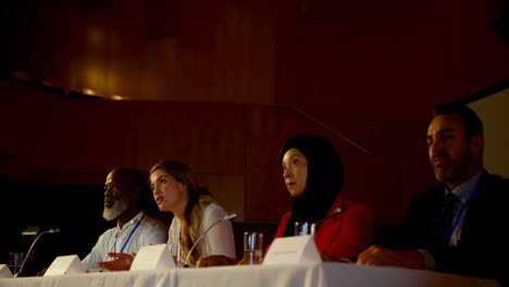 Beautiful-young-Caucasian-businesswoman-speaks-in-business-seminar-in-auditorium-4k