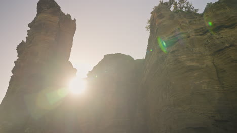 slow motion shot of beautiful tropical coastline cliffs from sea level