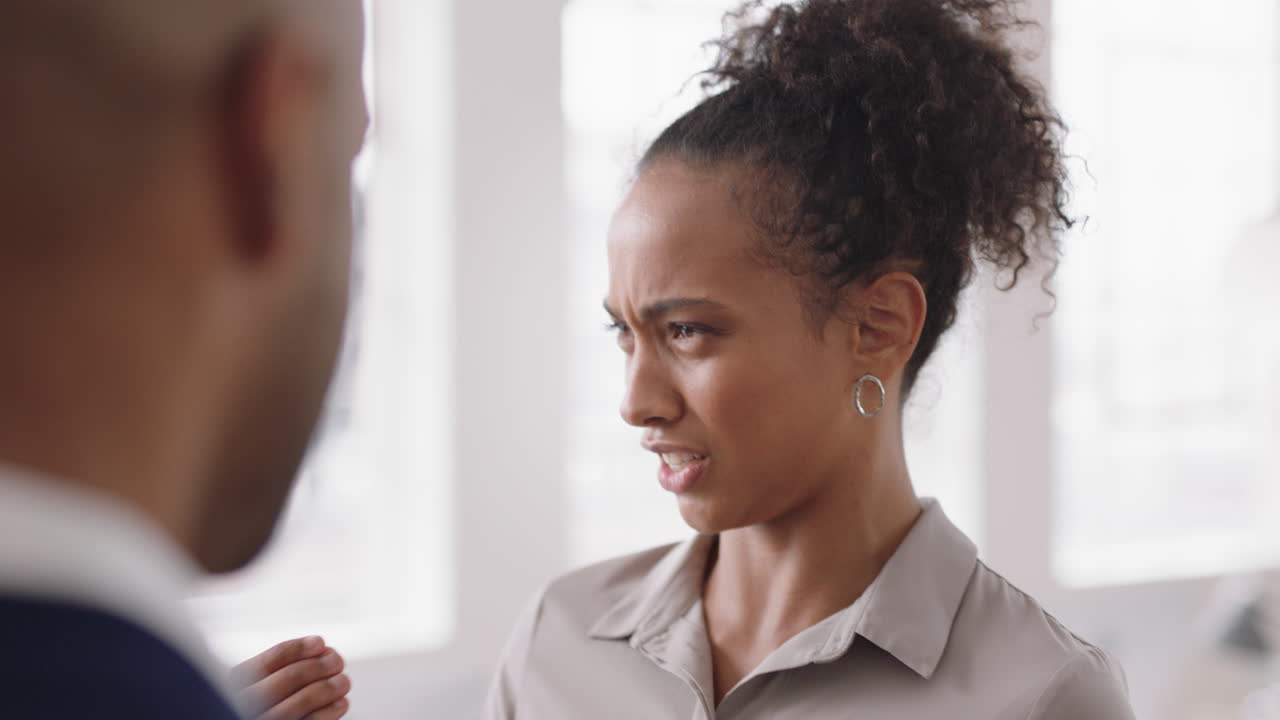 beautiful mixed race business woman chatting with clients smiling enjoying developing corporate partnership discussing project in modern office workspace
