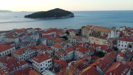 panning aerial view of dubrovnik old town and marina at adriatic sea