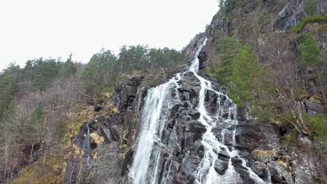 kvernhusfossen waterfall in mo modalen norway, aerial reveal