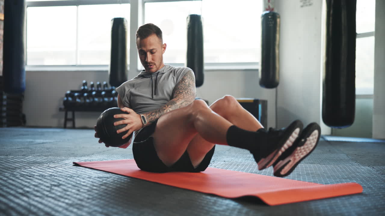 Fitness, gym and man on floor with ball for core