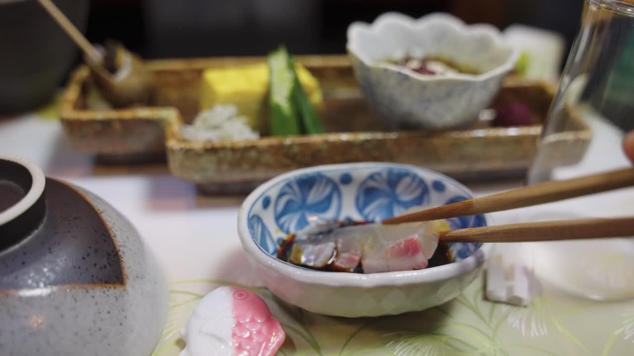 Japanese Sea-Bream Sashimi Dipped in Soy Sauce with Chopsticks, Kaiseki Banquet