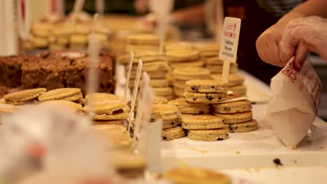 welsh cakes being packaged at a bakery stall