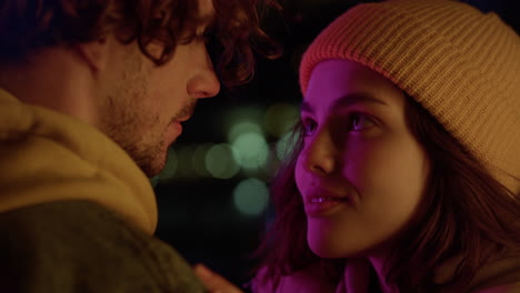 Affectionate-couple-looking-eyes-to-eyes-outdoor.-Woman-hugging-man-on-street.