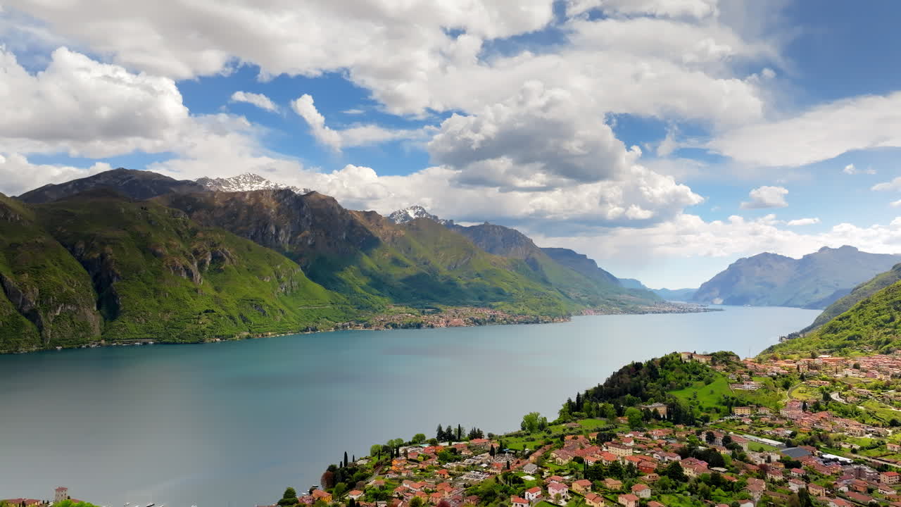 Lateral Aerial drone panorama of Lake Como surrounded by mountains in Italy