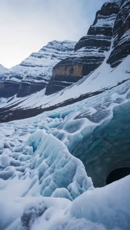 abstract blue ice formations and ice caves in a winter mountain landscape