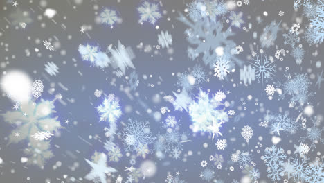 digital animation of snow falling against multiple snowflakes icons on blue background