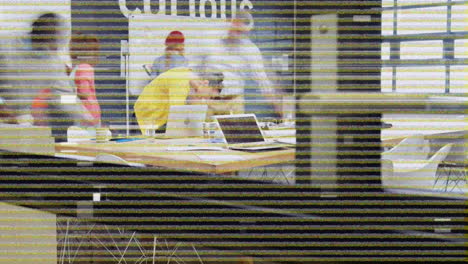 colleagues working in a busy office