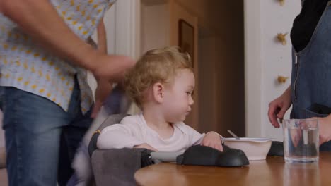 caucasian family cleaning table at home