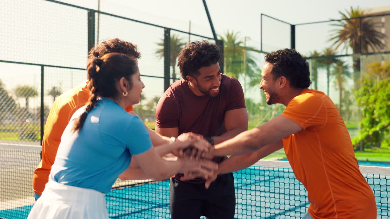 Happy Diverse Group of Friends Celebrating Success on a Padel Court