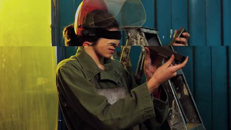 female welder examining a piece of metal