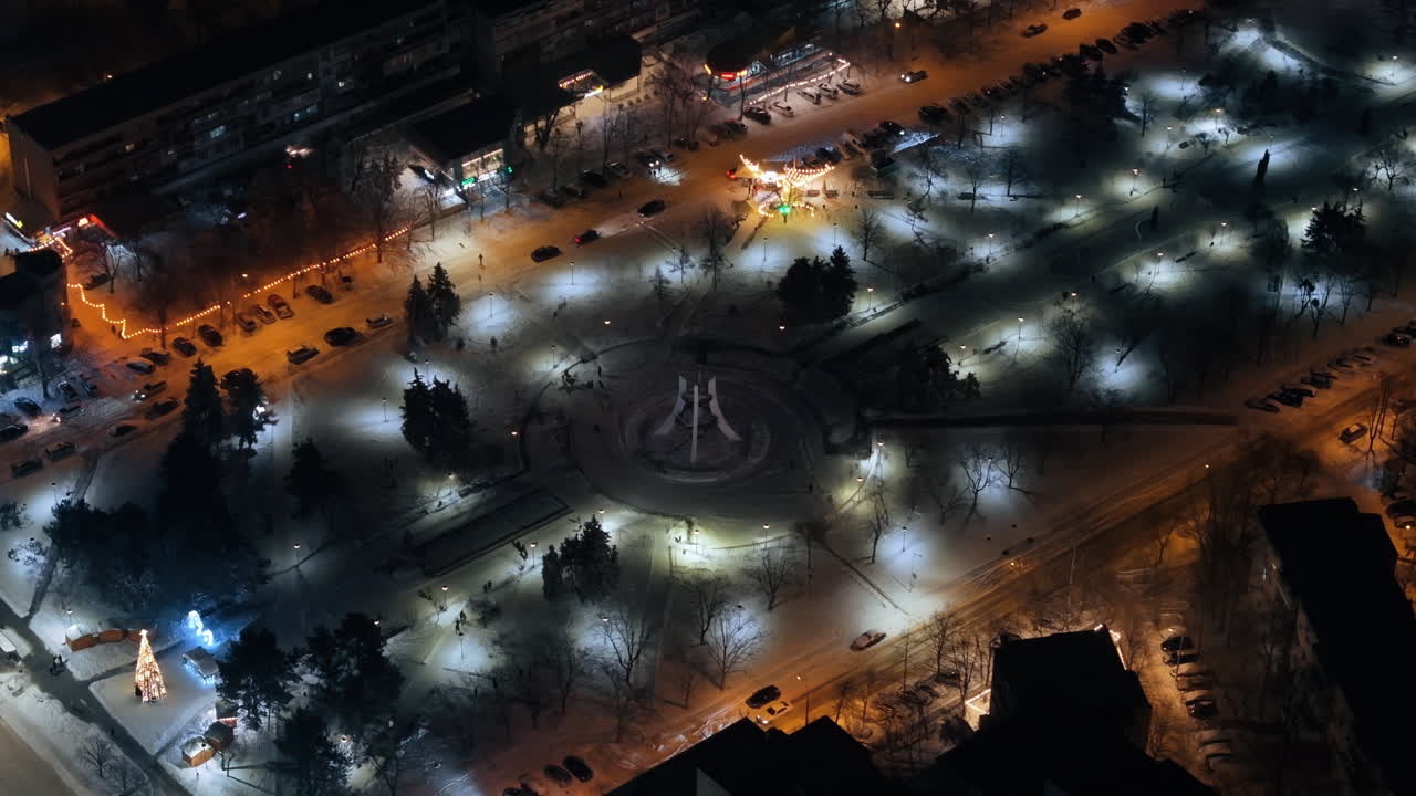 Aerial drone view of Chisinau city covered in snow at night, blue hour. Moldova
