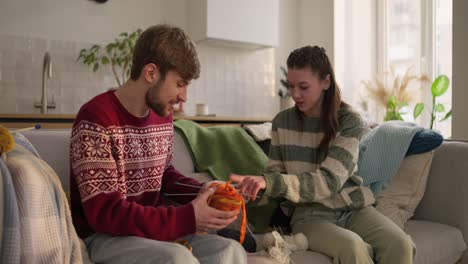 couple knitting together at home