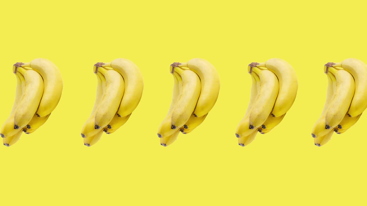 노란색 배경 클로즈업에 애니메이션으로 많은 바나나 어리