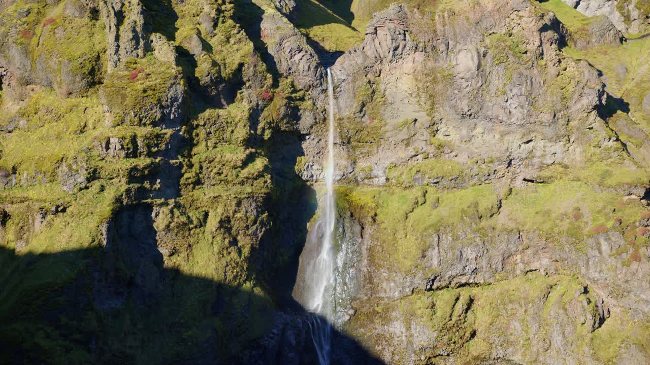 M&uacute;laglj&uacute;fur Canyon in evening light between a large waterfall on rising slopes in Iceland