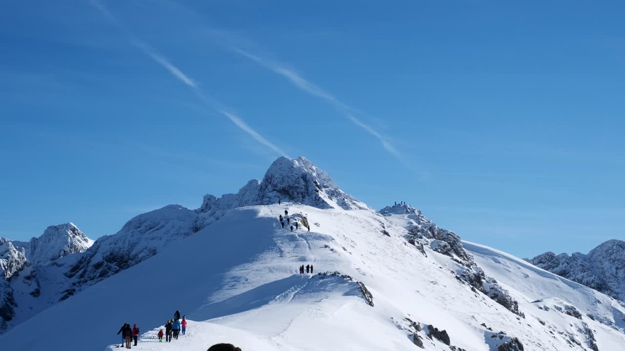 Winter Hiking on Snowy Mountain Peaks