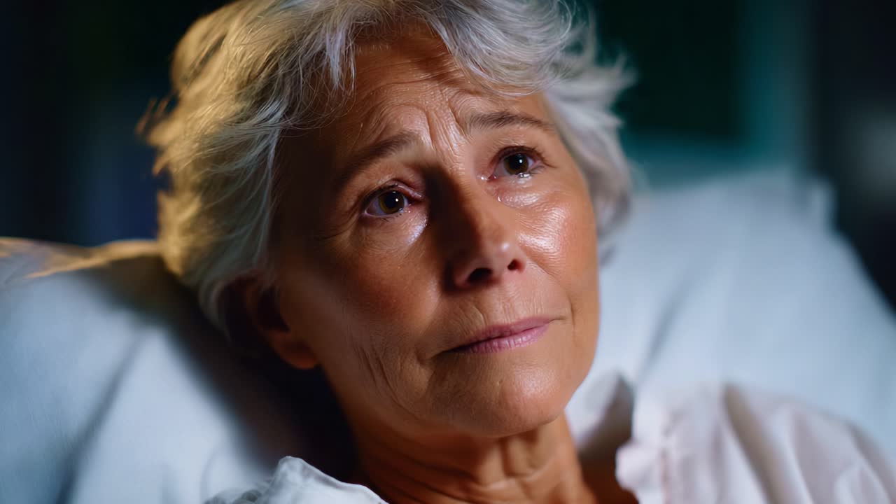 An Emotional Journey: A Compassionate Moment of Reflection with a Senior Woman in a Hospital Setting, Capturing Vulnerability and Resilience in Her Eyes