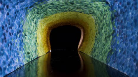 colorful rainbow corridor tunnel walkway slider shot traveling through