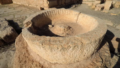 round-shaped carved rock at archaeological site of sbeitla in tunisia