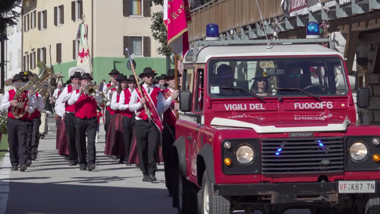 La brava Part - end of summer parade lead by the local fire brigade and a brass band passes through the village