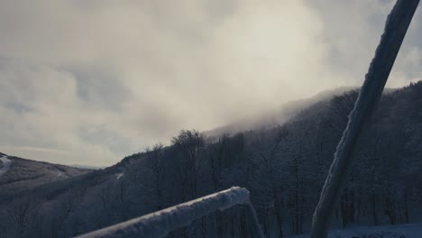 foggy mountains against cloudy sky in mount orford ski resort in quebec, canada