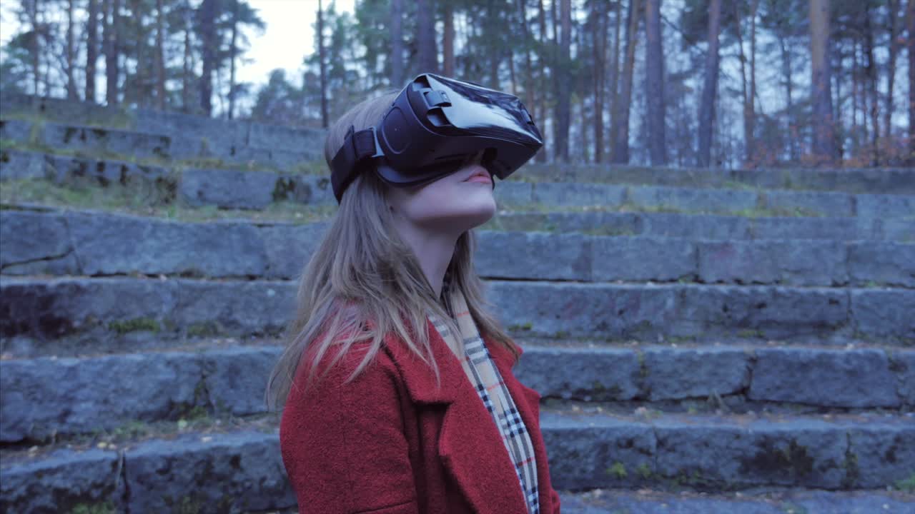 Woman experiencing virtual reality in a park