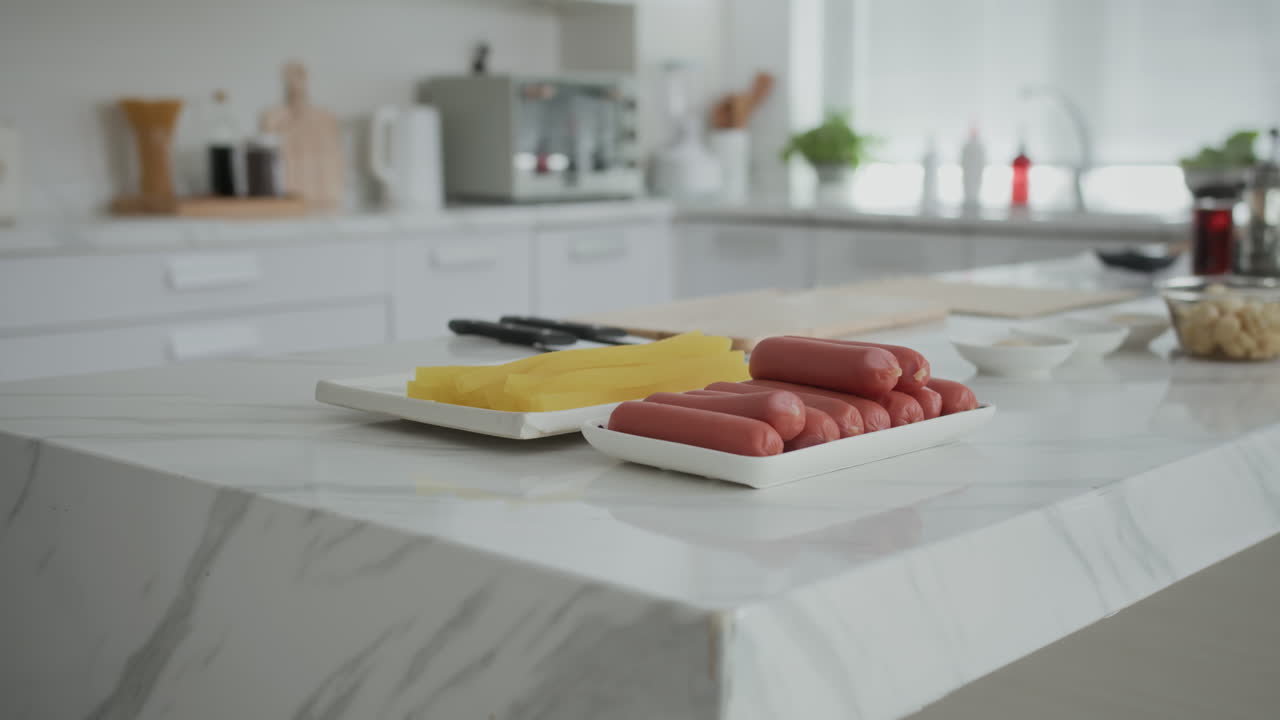 Sausages and Yellow Radish on Kitchen Counter at Home