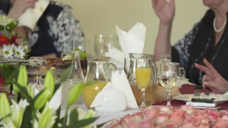 senior citizens celebrate holidays at festive dinner.