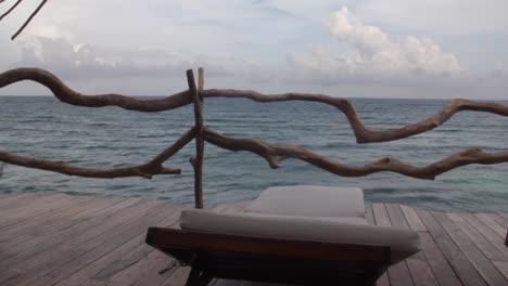 first person vision, long shot inside a balcony looking to the caribbean ocean during a cloudy day