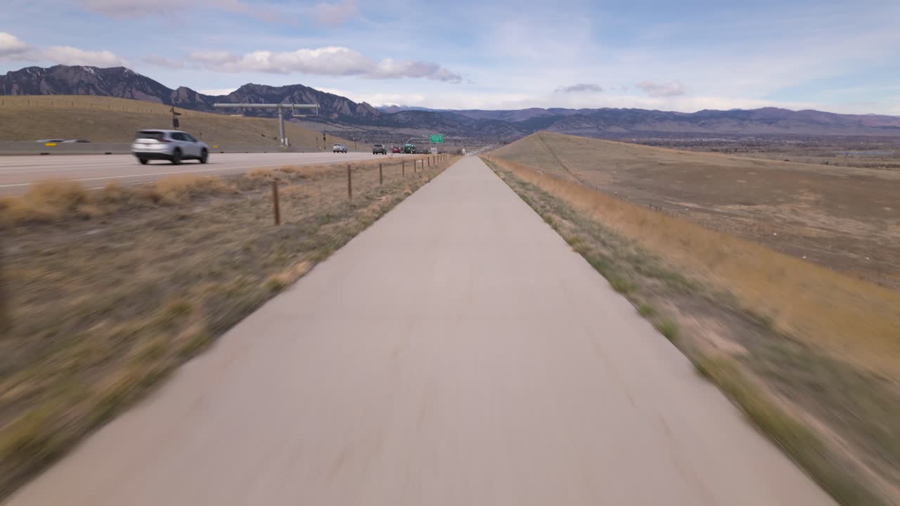 Cyclist Over Recreational Route Of US 36 Bikeway In Colorado Near Denver, USA. POV, Tilt-up Shot