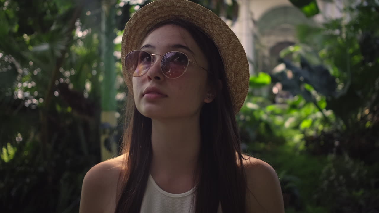 Young Woman in a Greenhouse