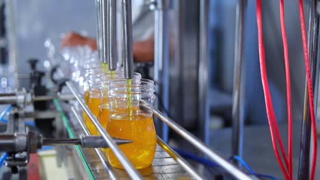 orange juice bottles transfer on conveyor belt system