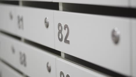 close-up of apartment mailboxes with number 82