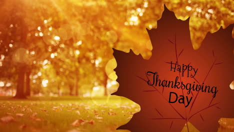 animation of happy thanksgiving day text over autumn leaf and park background