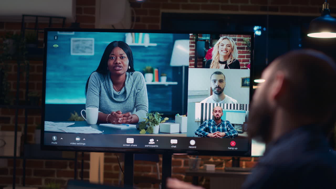 Employees talking with team in teleconference, screen close up