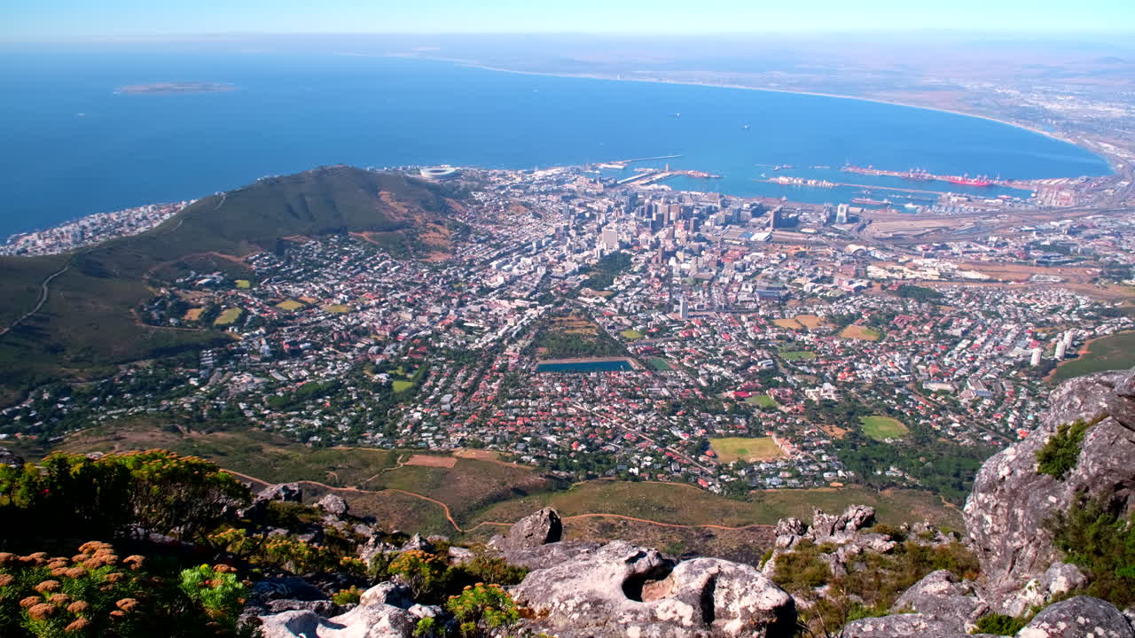 Scenic reveal shot of Cape Town city bowl and Table Bay with other landmarks
