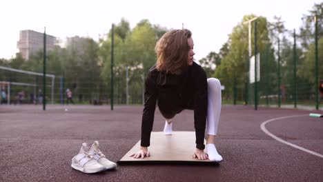 young woman stretching outdoors