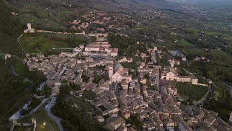 assisi's sideway aerial view, umbria, italy, city of peace, sunset, 4k