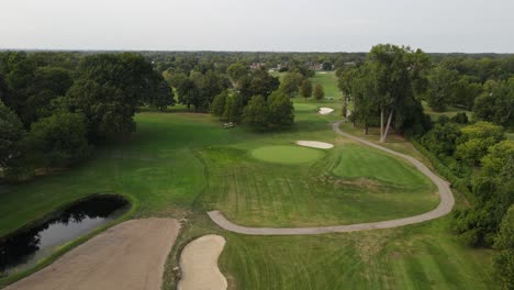 green meadow of golf fields in america, aerial drone view of plum brook golf course in sterling heights michigan