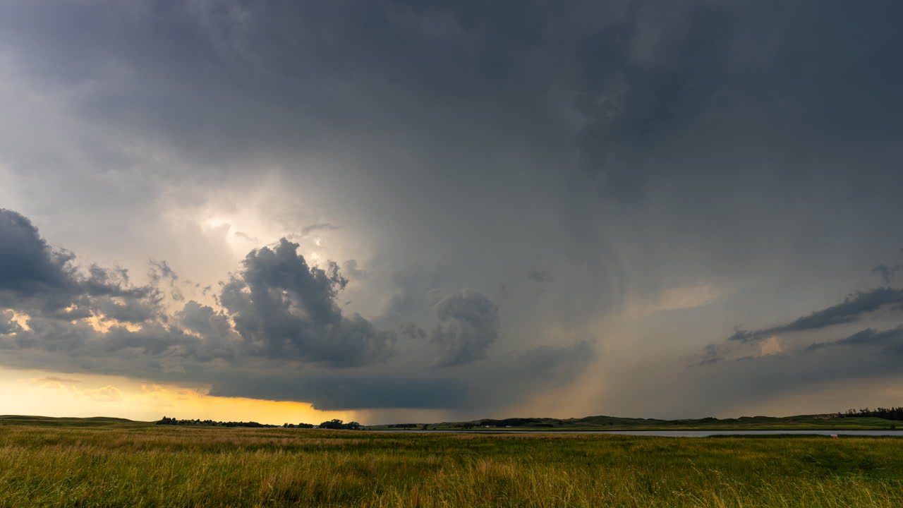 Big stormy scene with dark threatening clouds looming time lapse