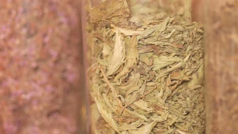 dried stevia leaves in a glass jar